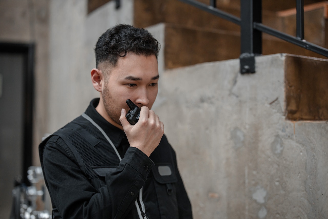 A man using a MURS walkie-talkie on a jobsite