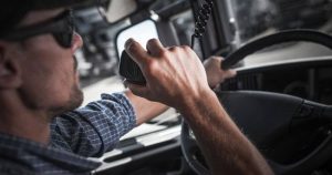 Truck Driver Talking On A CB Radio